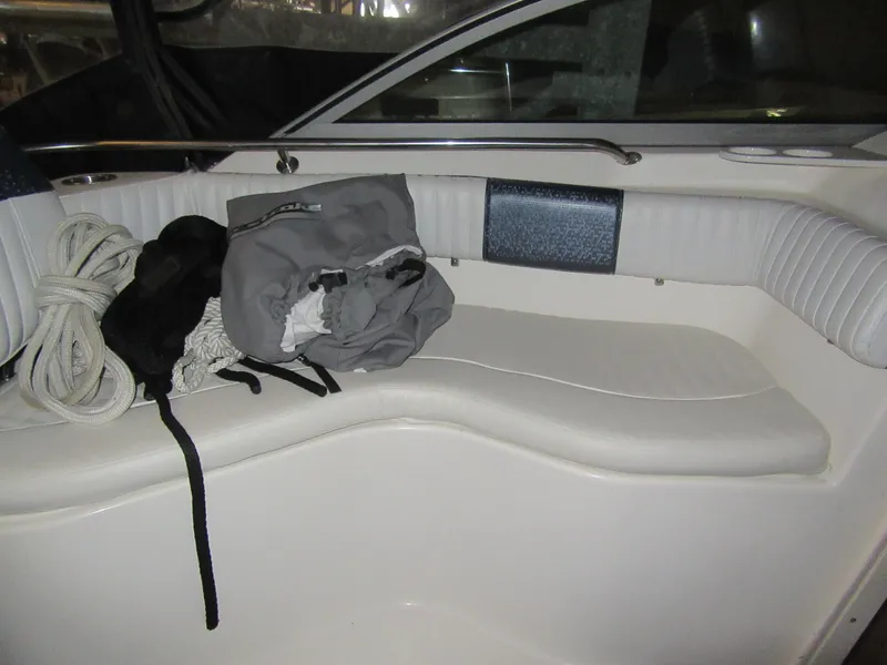 Slide: The Image of Interior seating of a 2002 Boston Whaler 295 Conquest boat with gear. - 15