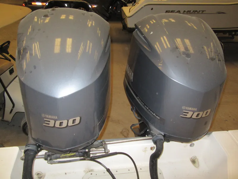 Slide: The Image of Twin Yamaha 300 outboard engines on a 2002 Boston Whaler 295 Conquest boat. - 21