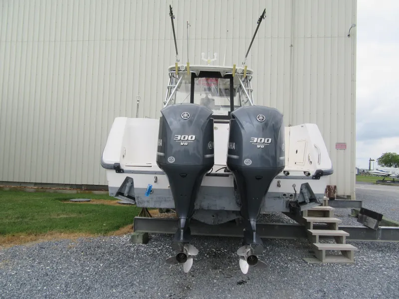 Slide: The Image of 2002 Boston Whaler 295 Conquest with twin Yamaha 300 HP engines. - 3