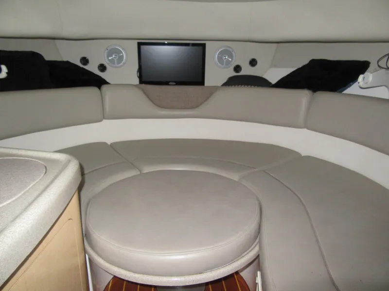 Slide: The Image of Interior cabin of a 2002 Boston Whaler 295 Conquest boat with seating and TV. - 4
