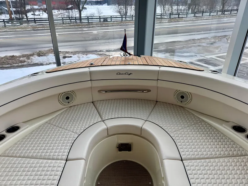 Slide: The Image of 2023 Chris-Craft Launch 31 GT boat interior with elegant seating and wood accents. - 12