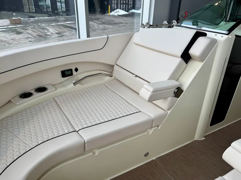 Slide: The Image of 2023 Chris-Craft Launch 31 GT interior with luxurious white seating and modern design. - 14