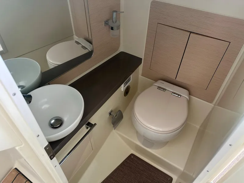 Slide: The Image of 2023 Chris-Craft Launch 31 GT boat bathroom with modern sink and toilet. - 15