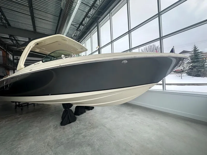 Slide: The Image of 2023 Chris-Craft Launch 31 GT boat displayed indoors. - 4