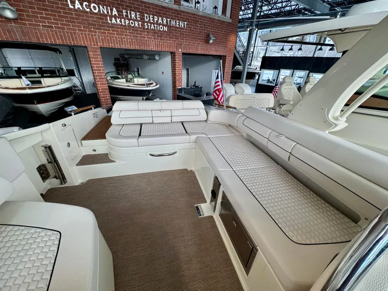 Slide: The Image of 2023 Chris-Craft Launch 31 GT boat interior with luxurious seating and elegant design. - 8