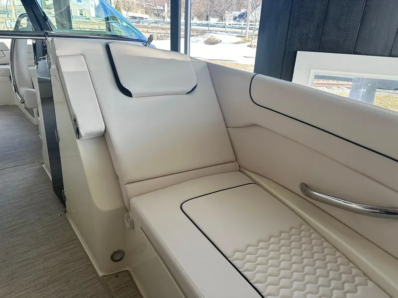 Slide: The Image of 2024 Chris-Craft Launch 28 GT interior seating with luxurious white upholstery. - 20