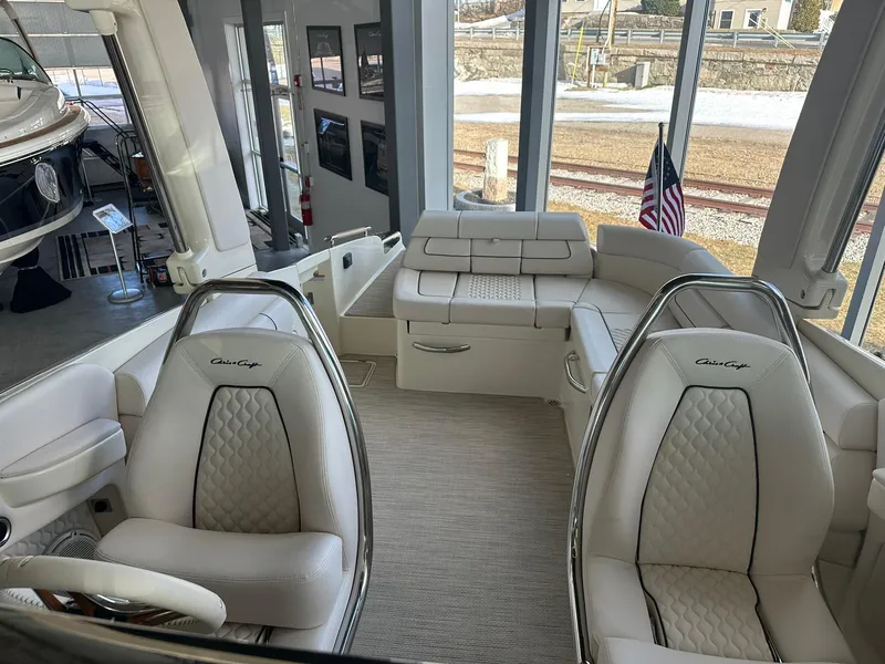 Slide: The Image of Interior of 2024 Chris-Craft Launch 28 GT boat with luxurious seating and modern design. - 21