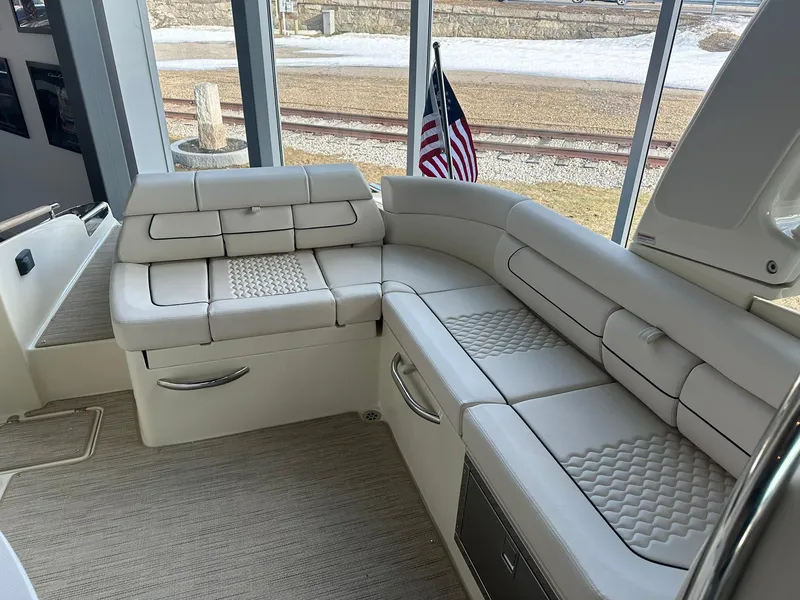 Slide: The Image of 2024 Chris-Craft Launch 28 GT interior seating area with luxurious white upholstery. - 24