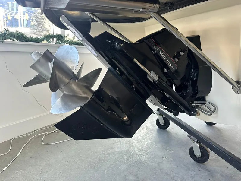 Slide: The Image of 2024 Chris-Craft Launch 28 GT boat propeller and engine detail in showroom. - 30