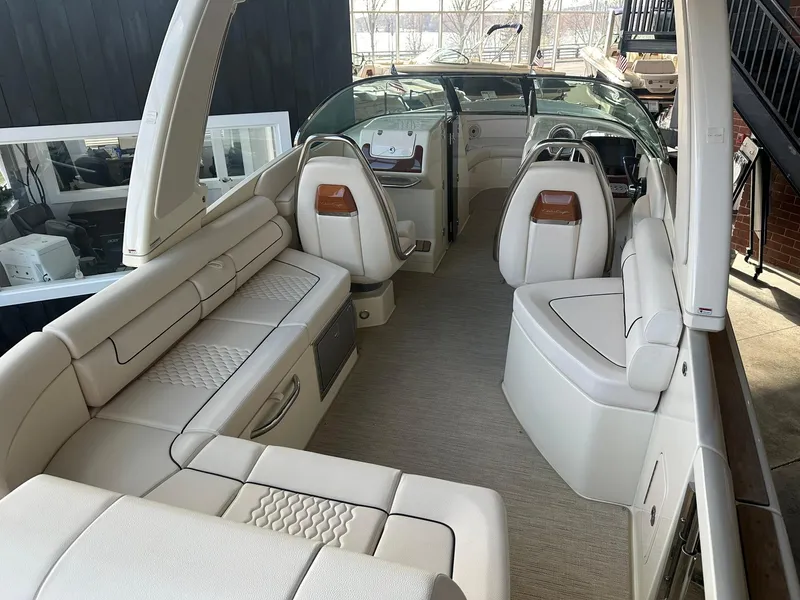 Slide: The Image of 2024 Chris-Craft Launch 28 GT interior with luxurious white seating and modern dashboard. - 8