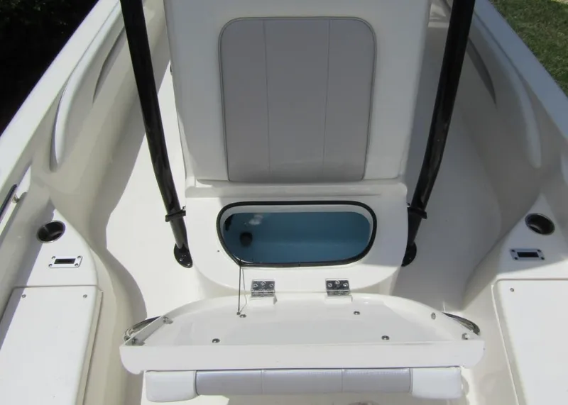 Slide: The Image of 2021 ShearWater 250 Carolina Bay boat interior with open storage compartment. - 10