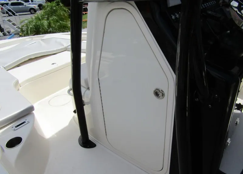 Slide: The Image of 2021 ShearWater 250 Carolina Bay boat interior with storage compartment. - 11