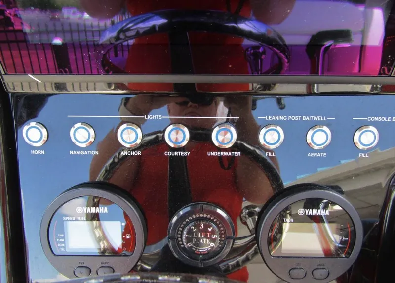 Slide: The Image of Control panel of a 2021 ShearWater 250 Carolina Bay boat with Yamaha gauges. - 16