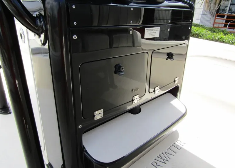 Slide: The Image of 2021 ShearWater 250 Carolina Bay storage compartments and step. - 18