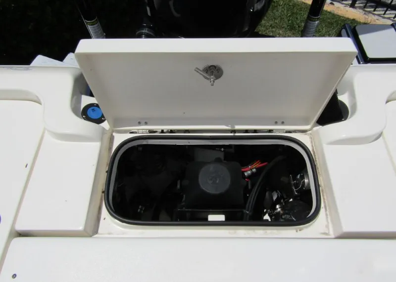 Slide: The Image of Open storage compartment on a 2021 ShearWater 250 Carolina Bay boat. - 25