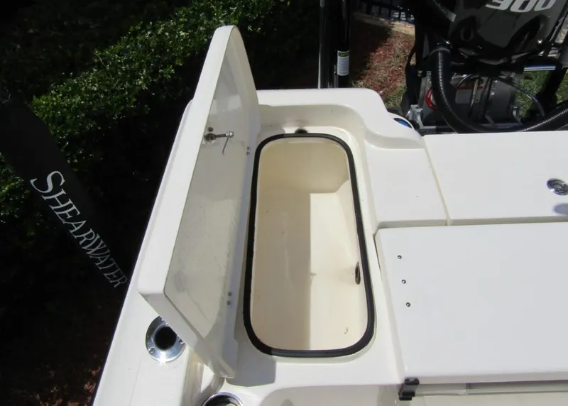 Slide: The Image of 2021 ShearWater 250 Carolina Bay boat storage compartment open. - 26