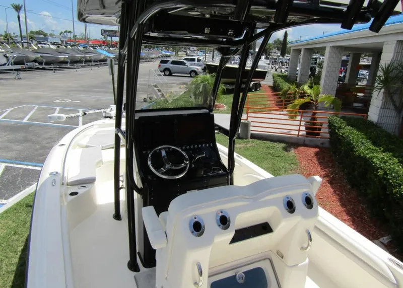 Slide: The Image of 2021 ShearWater 250 Carolina Bay boat interior with console and seating. - 29