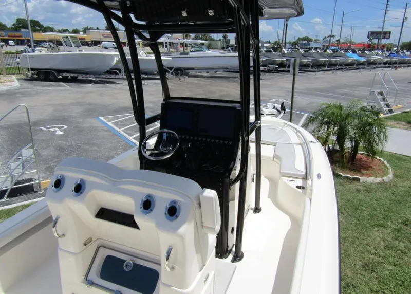 Slide: The Image of 2021 ShearWater 250 Carolina Bay boat interior with console and steering wheel. - 30