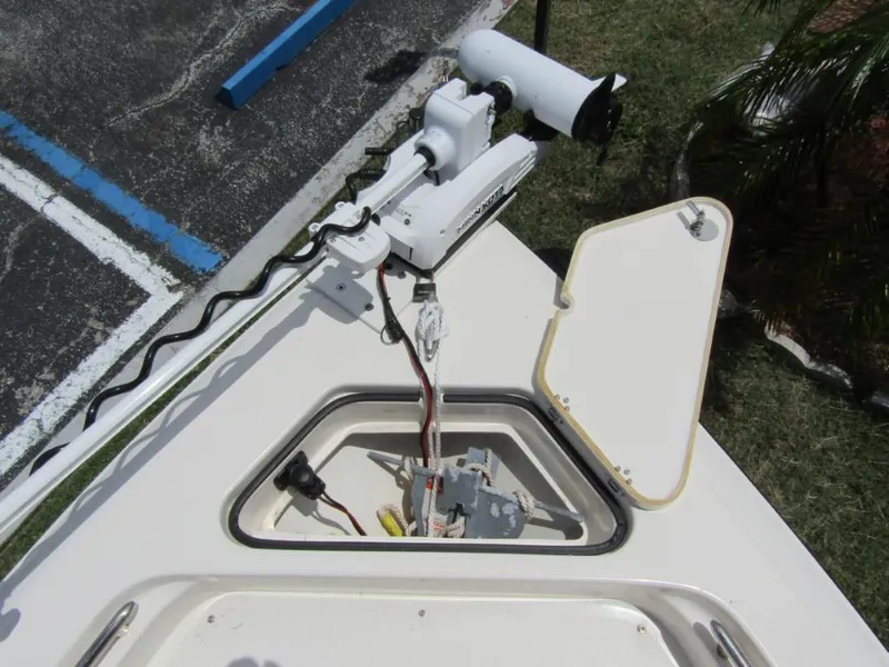 Slide: The Image of 2021 ShearWater 250 Carolina Bay boat with open hatch and mounted equipment. - 5