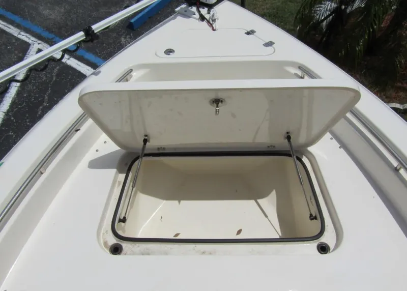 Slide: The Image of 2021 ShearWater 250 Carolina Bay boat storage compartment open. - 6