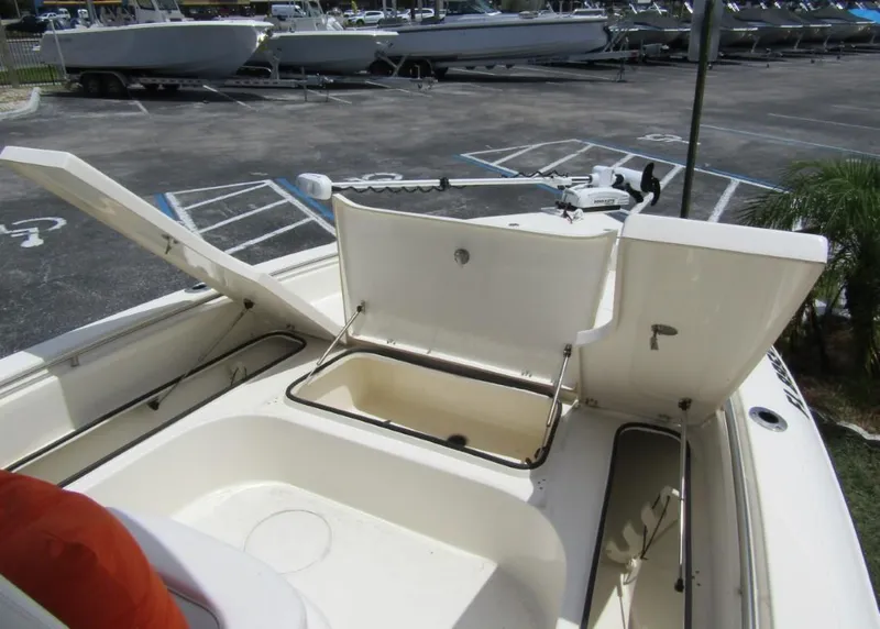 Slide: The Image of 2021 ShearWater 250 Carolina Bay boat with open storage compartments. - 8