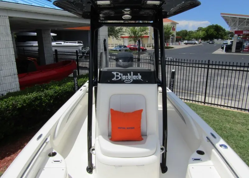 Slide: The Image of 2021 ShearWater 250 Carolina Bay boat with center console and seating. - 9