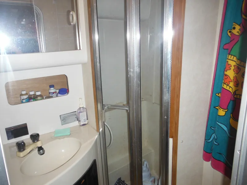 Slide: The Image of Bathroom in 1990 Silverton 34 Convertible boat with sink and shower. - 20