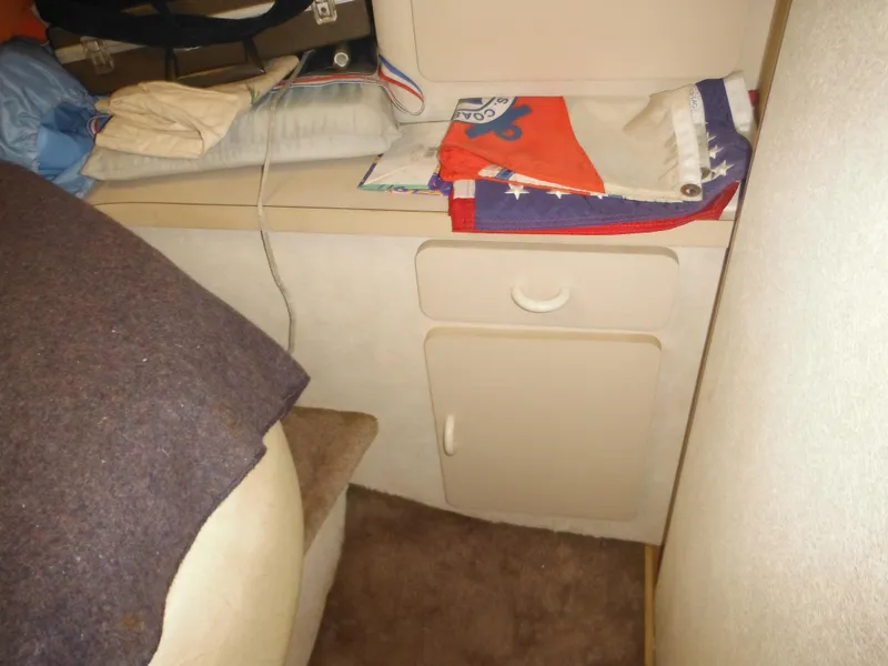 Slide: The Image of Interior cabin storage area of a 1990 Silverton 34 Convertible boat. - 23