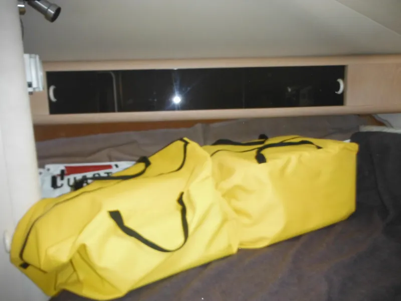 Slide: The Image of Yellow bags in cabin of 1990 Silverton 34 Convertible boat. - 26