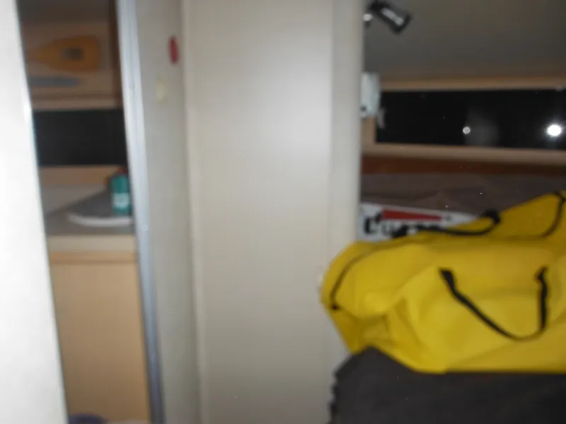 Slide: The Image of Interior of a 1990 Silverton 34 Convertible boat with yellow bag. - 27