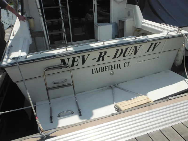 Slide: The Image of 1990 Silverton 34 Convertible boat docked, named NEV-R-DUN IV from Fairfield, CT. - 3