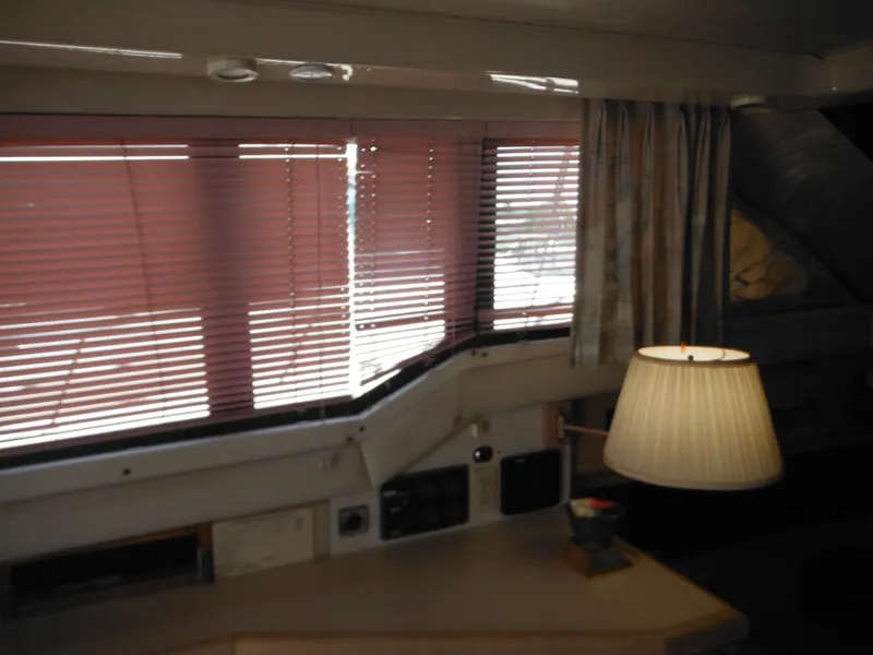 Slide: The Image of Interior of 1990 Silverton 34 Convertible yacht with blinds and lamp. - 38