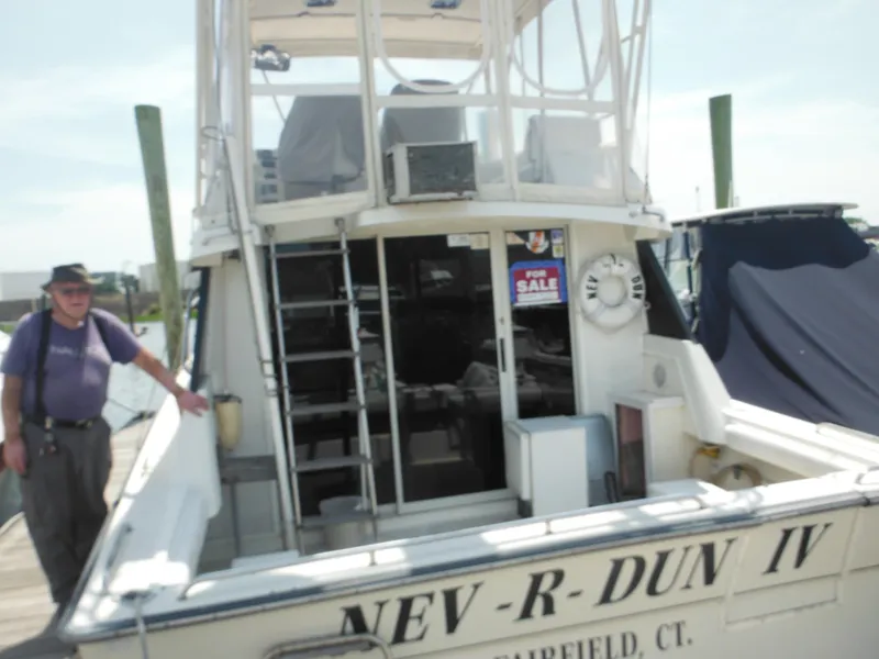 Slide: The Image of 1990 Silverton 34 Convertible boat NEV-R-DUN IV for sale at dock. - 4