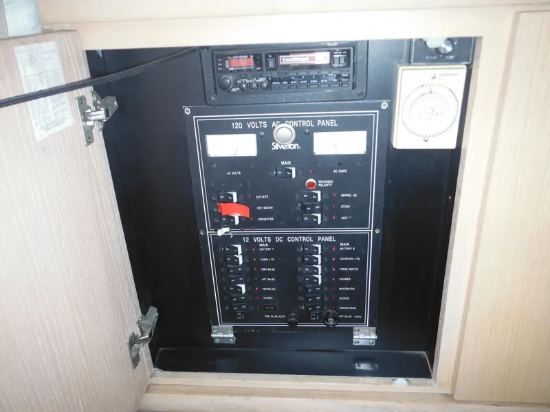 Slide: The Image of Electrical control panel of a 1990 Silverton 34 Convertible boat. - 41