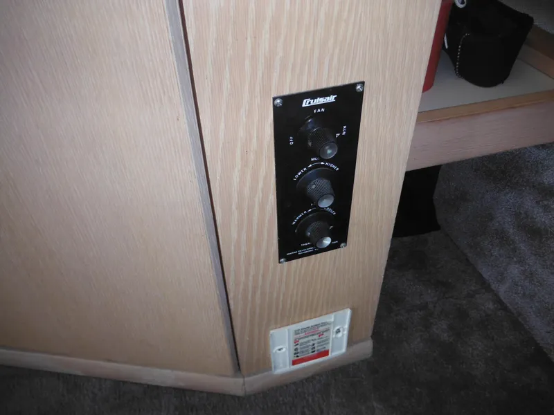 Slide: The Image of Control panel in 1990 Silverton 34 Convertible boat interior. - 42