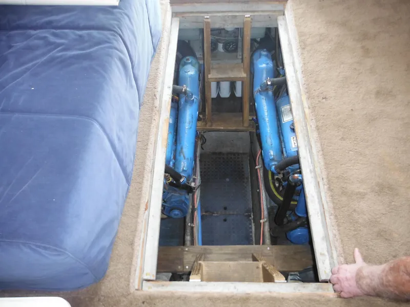 Slide: The Image of 1990 Silverton 34 Convertible engine compartment with twin blue engines. - 45