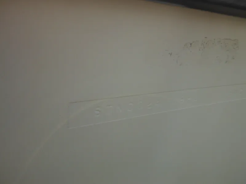 Slide: The Image of Hull identification number on a 1990 Silverton 34 Convertible boat. - 7