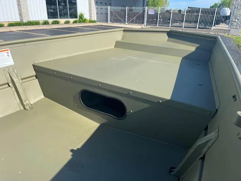 Slide: The Image of 2024 Lowe Jon L1648M Aura boat interior with storage compartment. - 11