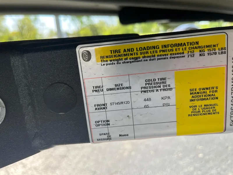 Slide: The Image of Tire and loading information label on a 2024 Lowe Jon L1648M Aura boat. - 13