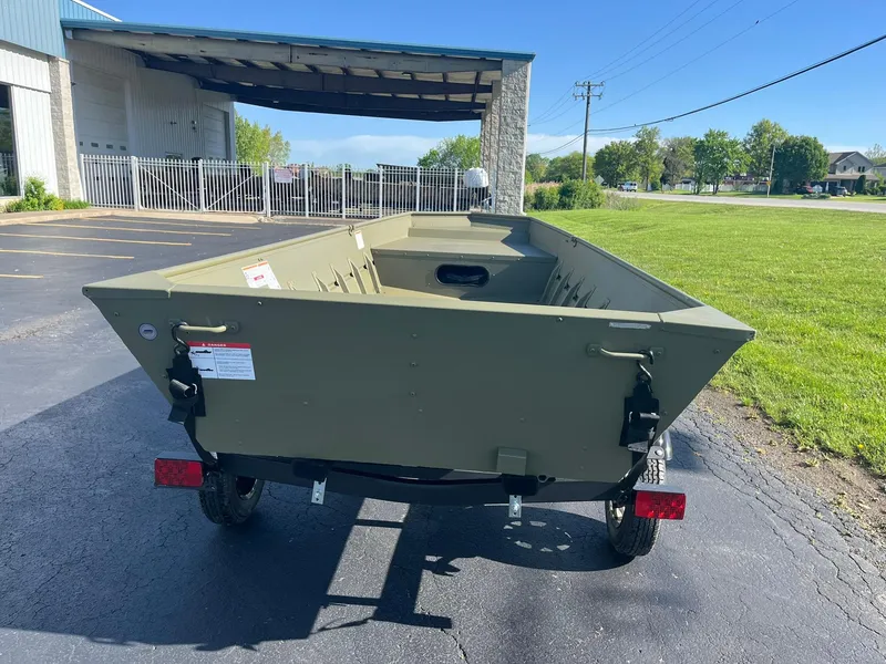 Slide: The Image of 2024 Lowe Jon L1648M Aura boat on trailer, parked outdoors. - 3