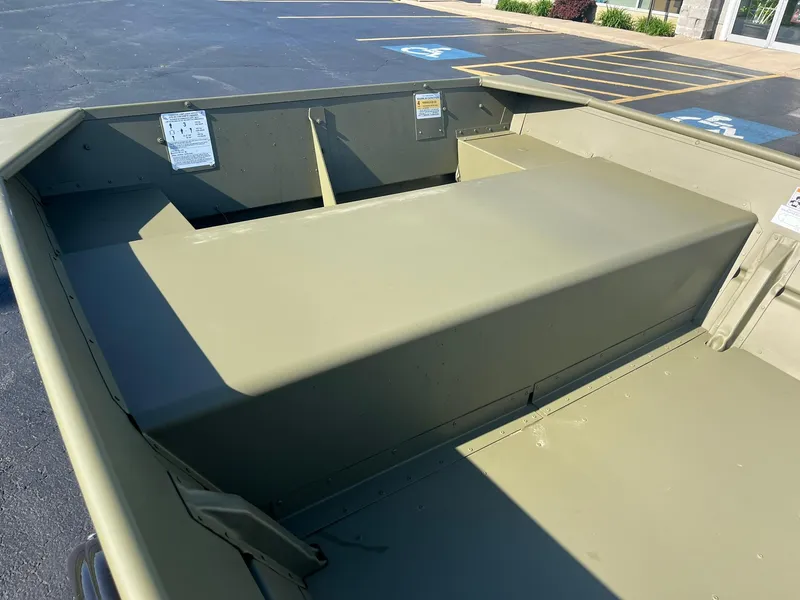 Slide: The Image of 2024 Lowe Jon L1648M Aura boat interior, olive green, spacious seating, and storage compartments. - 4
