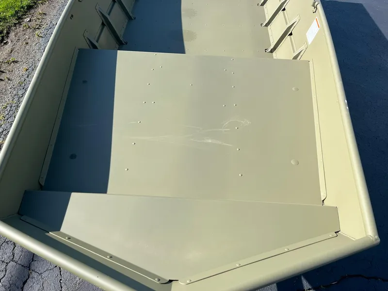 Slide: The Image of 2024 Lowe Jon L1648M Aura boat interior, showing the front deck and seating area. - 8