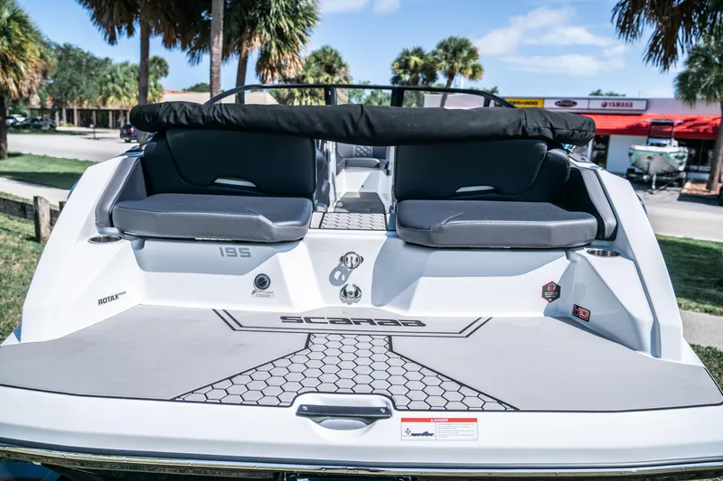 Slide: The Image of 2021 Scarab 195 boat rear view with seating and deck. - 8
