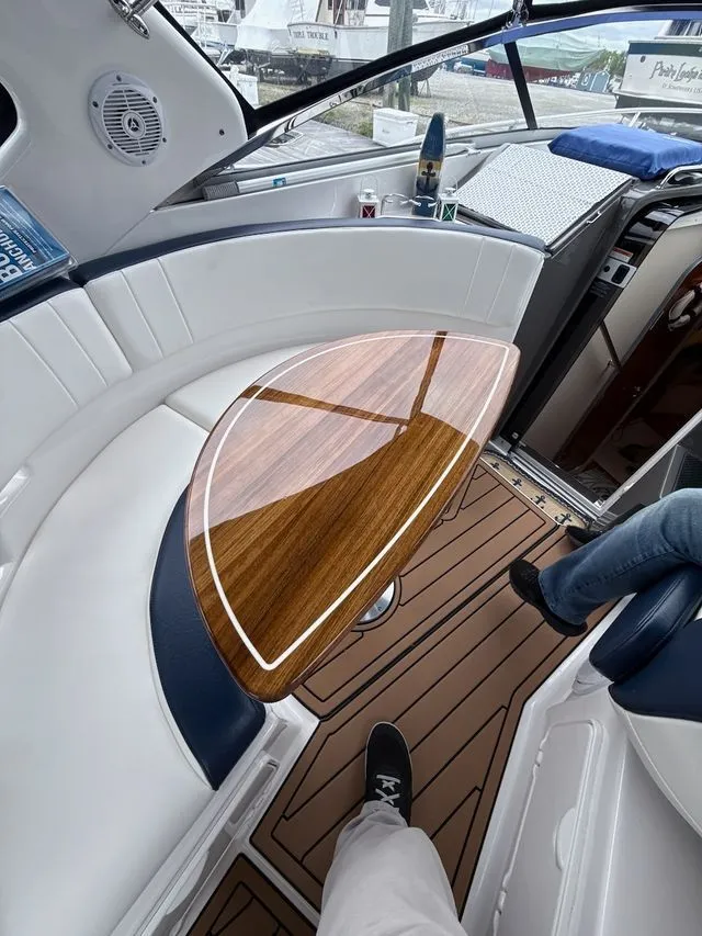 Slide: The Image of Interior of a 2008 Regal 3360 Window Express yacht with wooden table. - 15