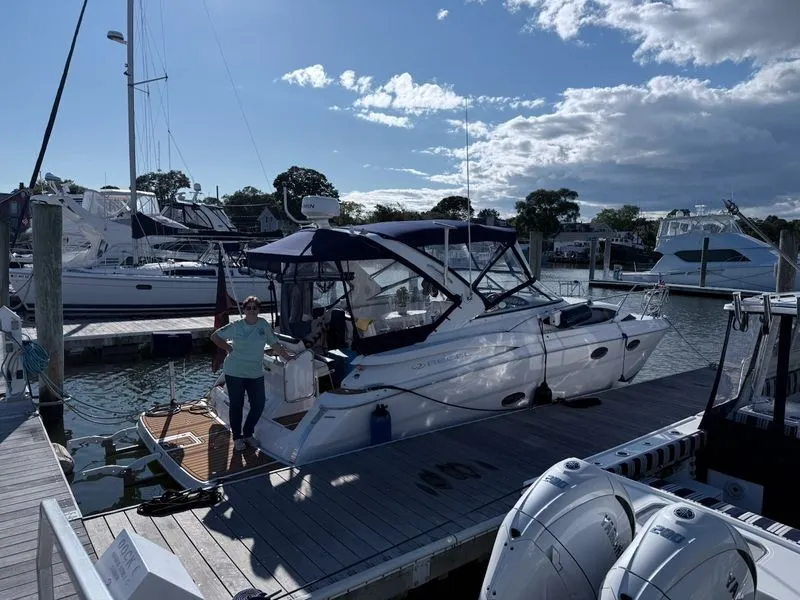 Slide: The Image of 2008 Regal 3360 Window Express docked with person on board. - 2