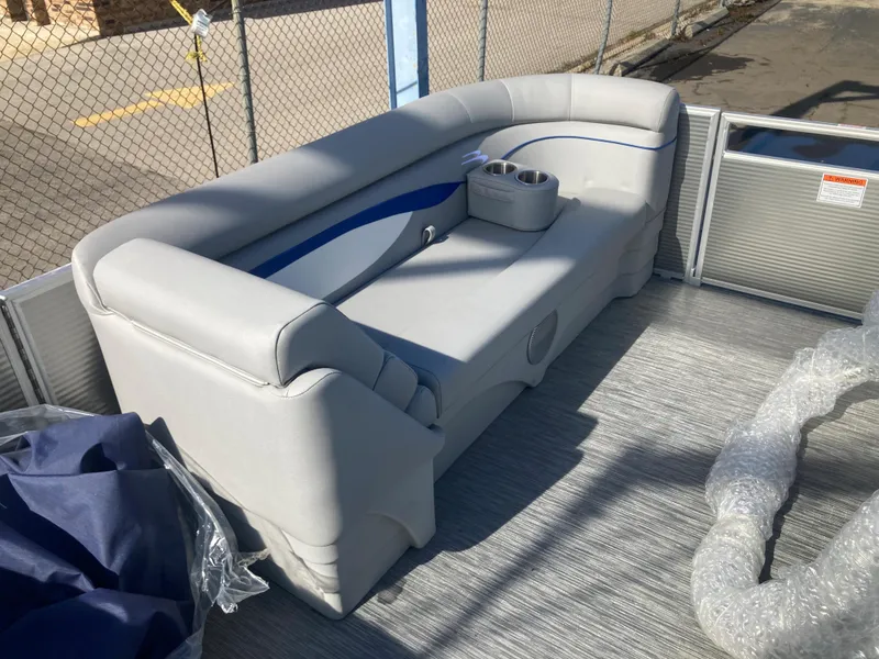 Slide: The Image of 2023 Bennington 21 SL pontoon boat with gray seating and cup holders. - 5
