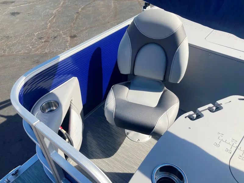 Slide: The Image of 2023 Bennington 22 SXSAPG boat seat with cup holders and blue paneling. - 2