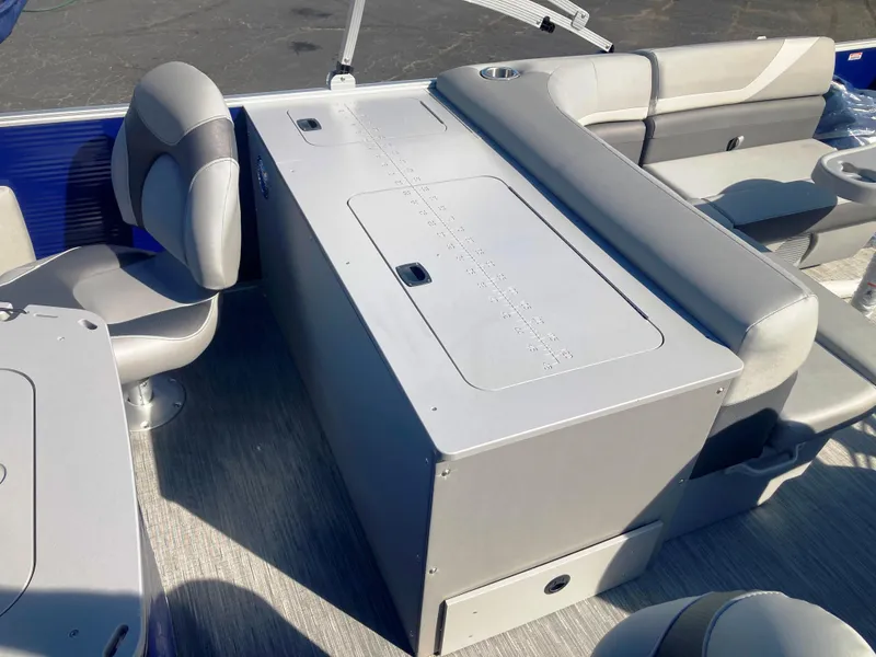 Slide: The Image of 2023 Bennington 22 SXSAPG boat interior with seating and storage compartments. - 3