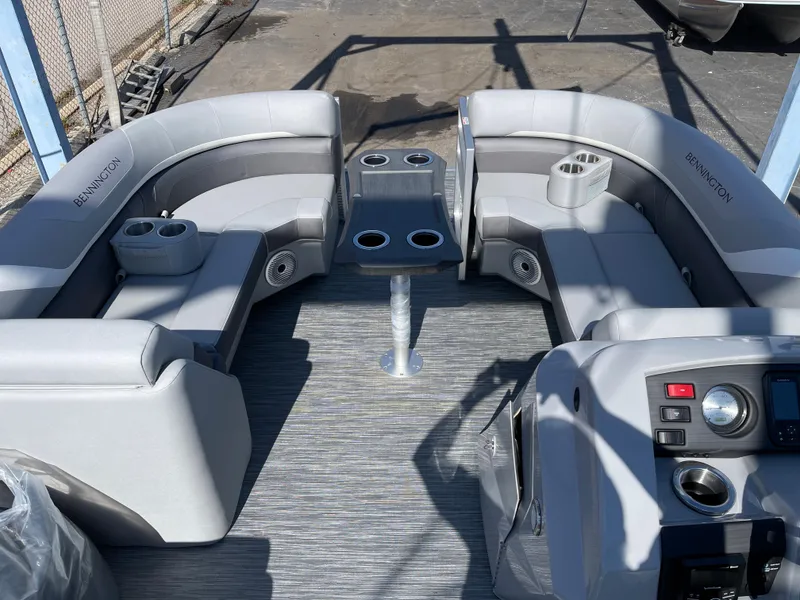 Slide: The Image of 2023 Bennington 22SXSR pontoon boat interior with gray seating and table. - 4