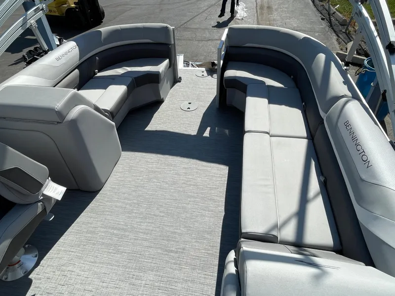 Slide: The Image of 2023 Bennington 22SXSR pontoon boat with spacious seating and modern design. - 6